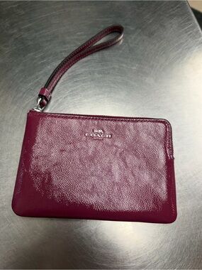 Coach Signature Zip Wristlet in Berry Pink